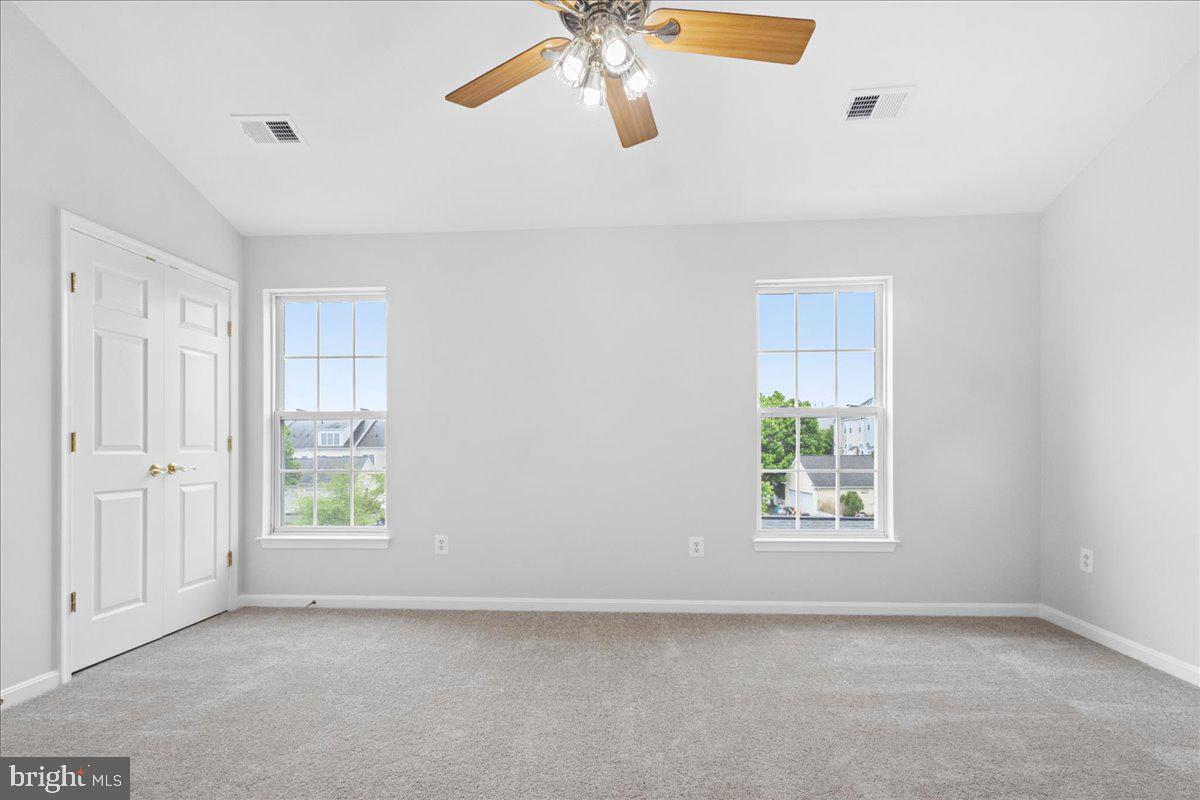 3618 Sprigg Street South Frederick, MD 21704 - Photo 6 of 37 an empty room with windows and fan