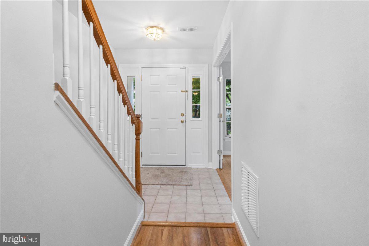 3618 Sprigg Street South Frederick, MD 21704 - Photo 9 of 37 a view of a hallway with wooden floor and staircase