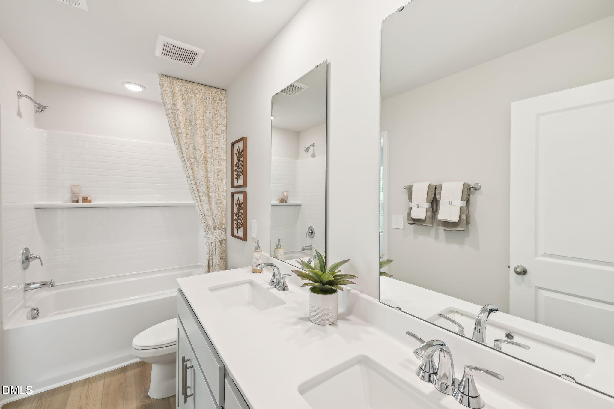 924 Broadleaf Trace Mebane, NC 27302 - Photo 23 of 26 a bathroom with a sink a toilet and a bathtub