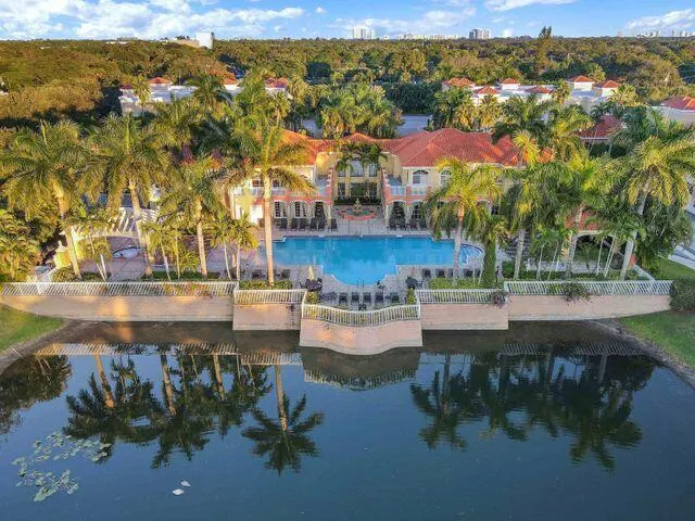 a view of swimming pool with outdoor seating and city view