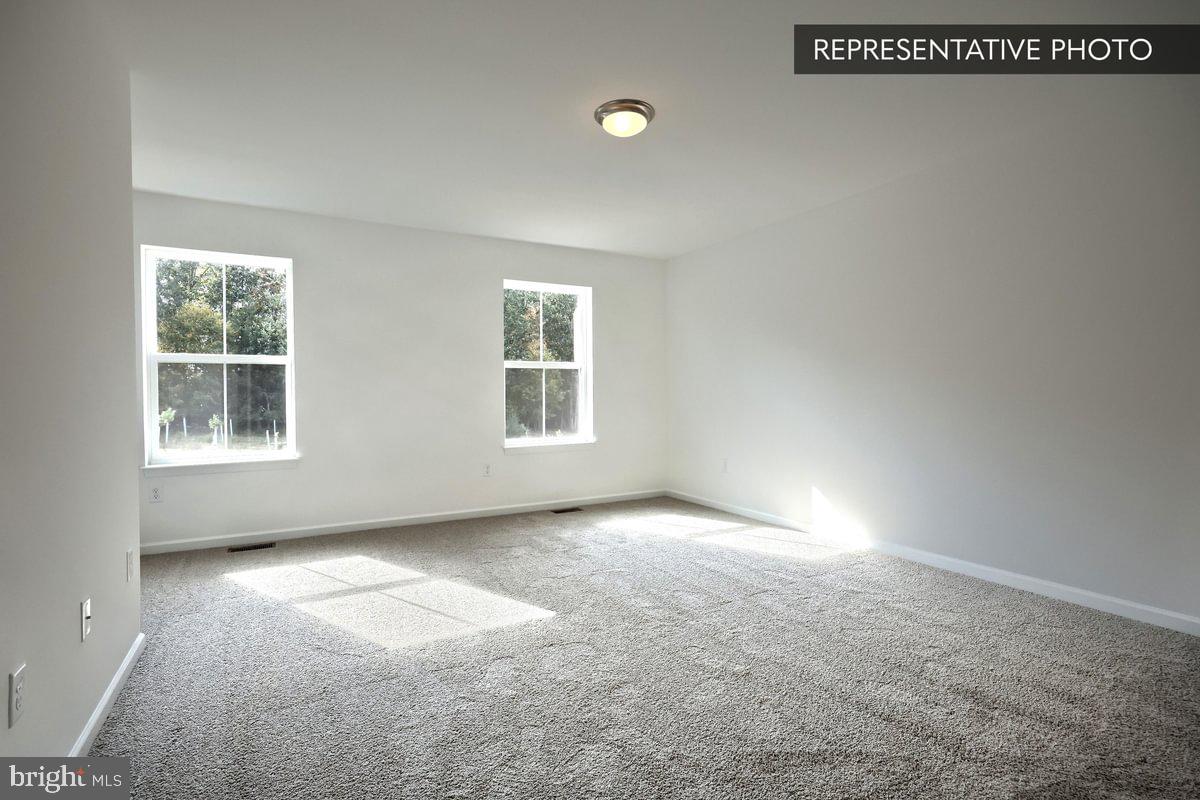 Sassafras Plan At Hills Spring Grove, PA 17362 - Photo 19 of 33 an empty room with windows