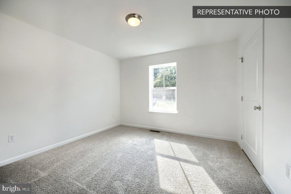 Sassafras Plan At Hills Spring Grove, PA 17362 - Photo 28 of 33 an empty room with windows