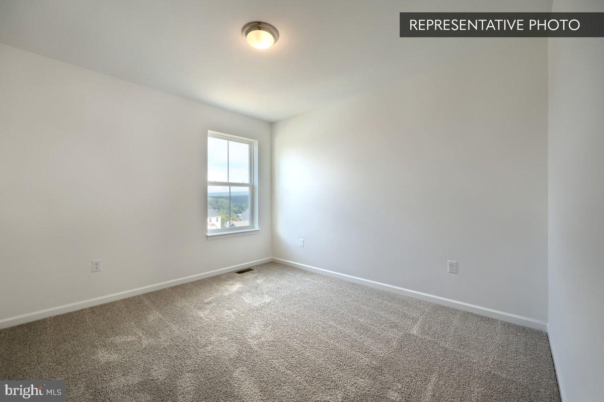 Sassafras Plan At Hills Spring Grove, PA 17362 - Photo 30 of 33 an empty room with windows