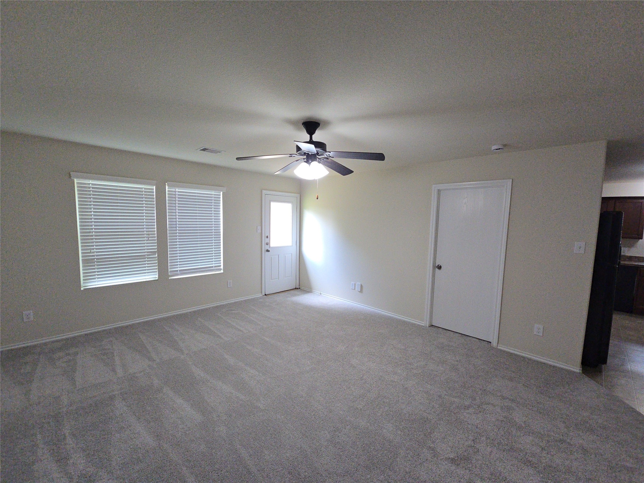 810 Lightningbug Lane Conroe, TX 77301 - Photo 3 of 27 a view of a livingroom with a ceiling fan and window