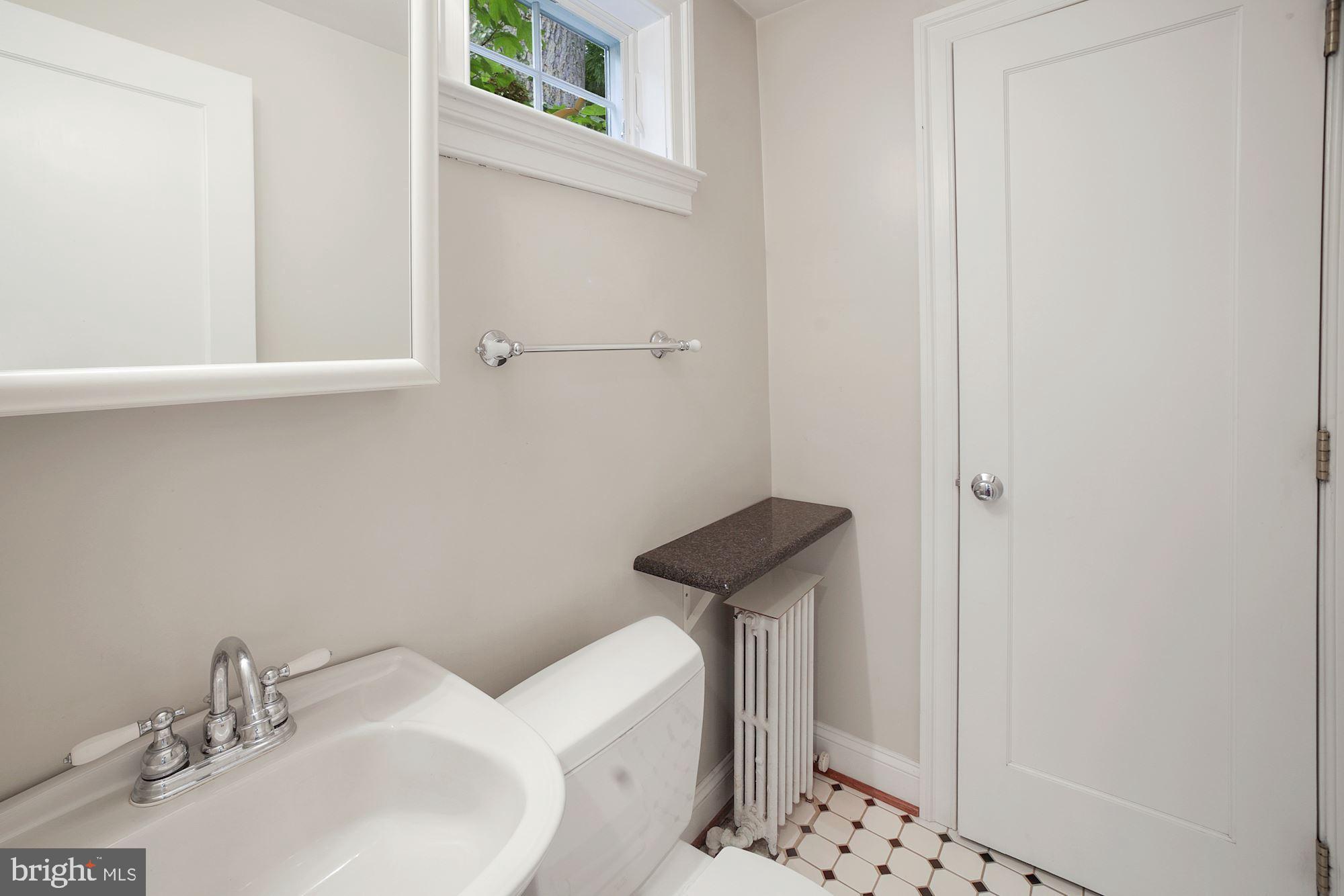6820 Meadow Lane Chevy Chase, MD 20815 - Photo 16 of 54 Powder room with storage closet