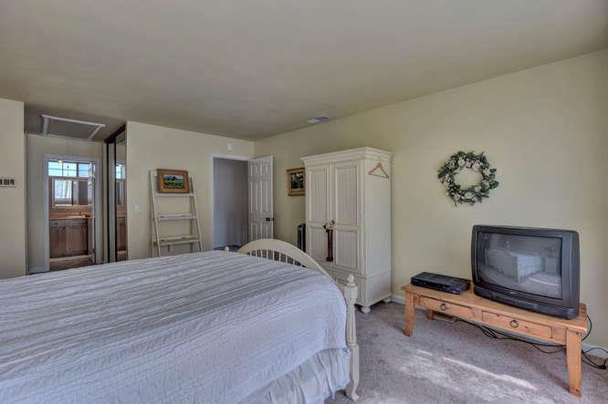 737 Superior Road Milpitas, CA 95035 - Photo 5 of 16 a bedroom with a bed and a flat screen tv