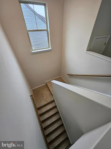 a view of a hallway with stairs