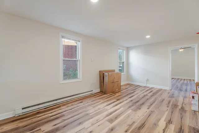 a room with a bed and a window