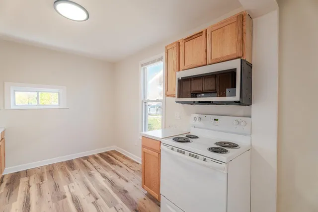 a kitchen with a stove and a microwave