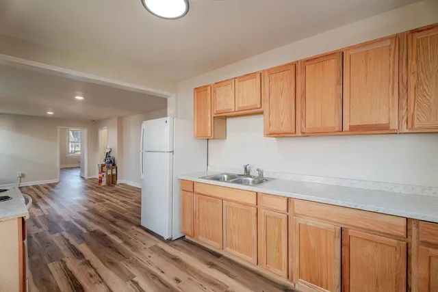 a kitchen with a sink and cabinets