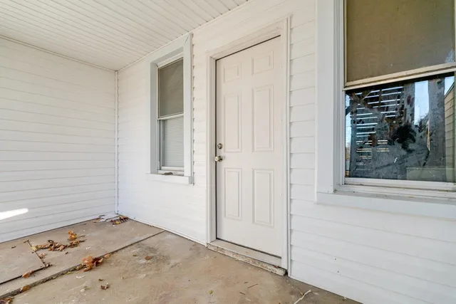 a view of a yard with a tree