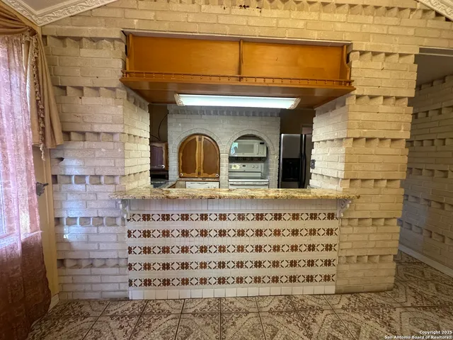 a bathroom with a glass door shower and sink