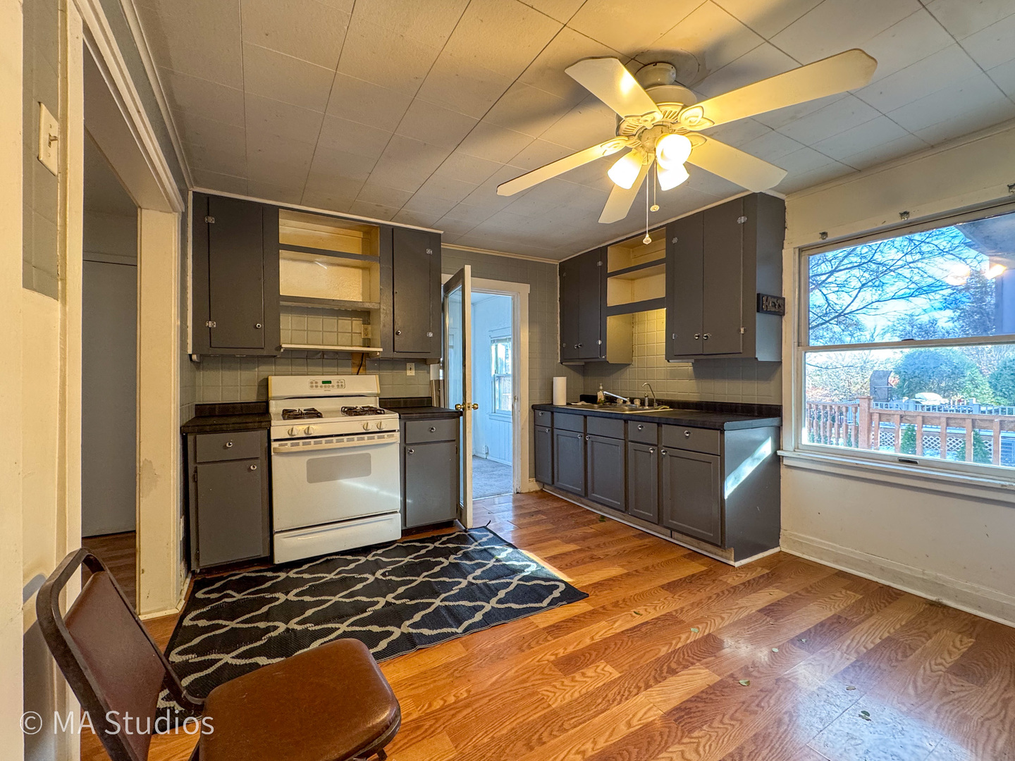 8-s057 South Vine Street Burr Ridge, IL 60527 - Photo 13 of 37 a kitchen with a stove a sink and a refrigerator
