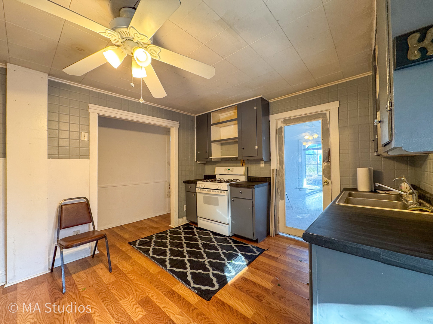 8-s057 South Vine Street Burr Ridge, IL 60527 - Photo 15 of 37 a kitchen with kitchen island a counter top space appliances and cabinets