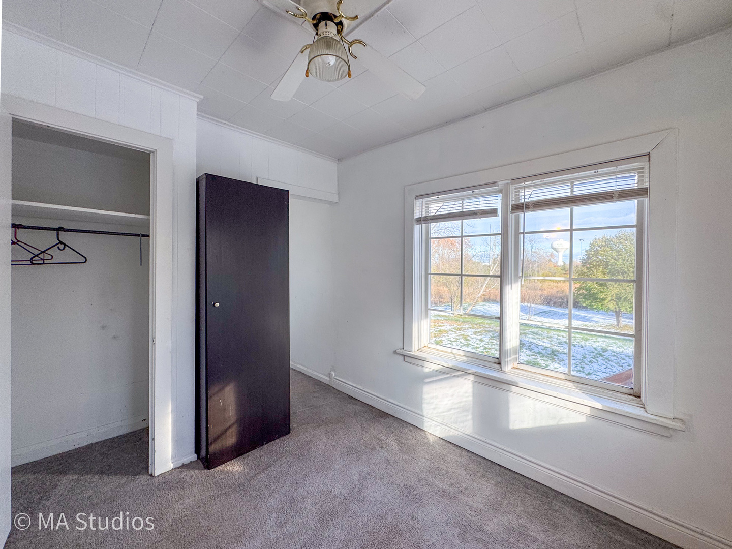 8-s057 South Vine Street Burr Ridge, IL 60527 - Photo 17 of 37 a view of an empty room with a window