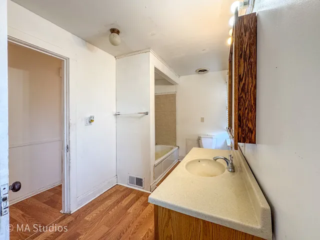 a bathroom with a sink and a mirror