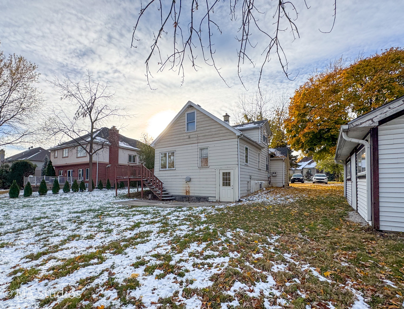 8-s057 South Vine Street Burr Ridge, IL 60527 - Photo 4 of 37 a view of a house with a yard covered in snow