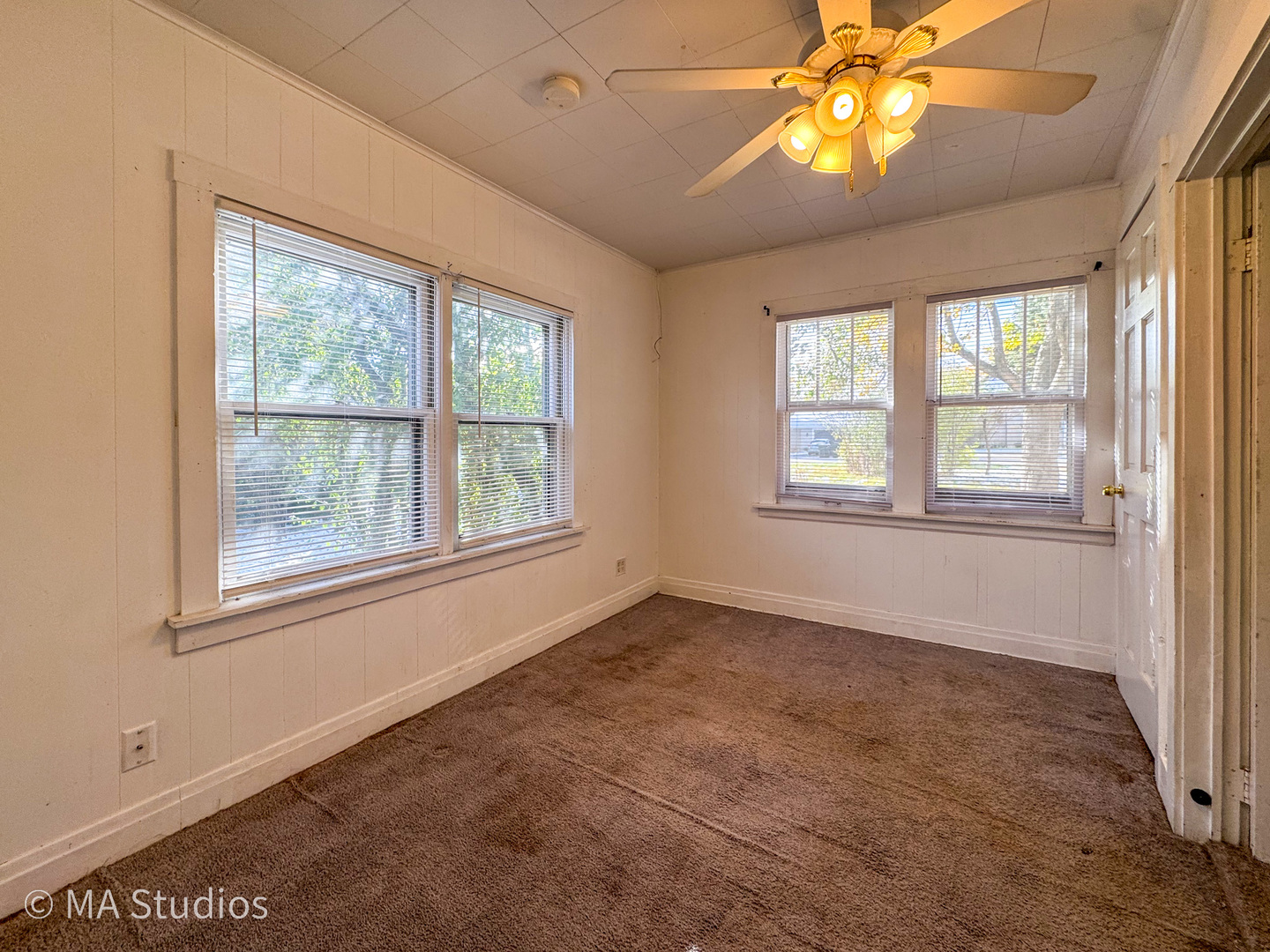 8-s057 South Vine Street Burr Ridge, IL 60527 - Photo 7 of 37 a view of an empty room with a window