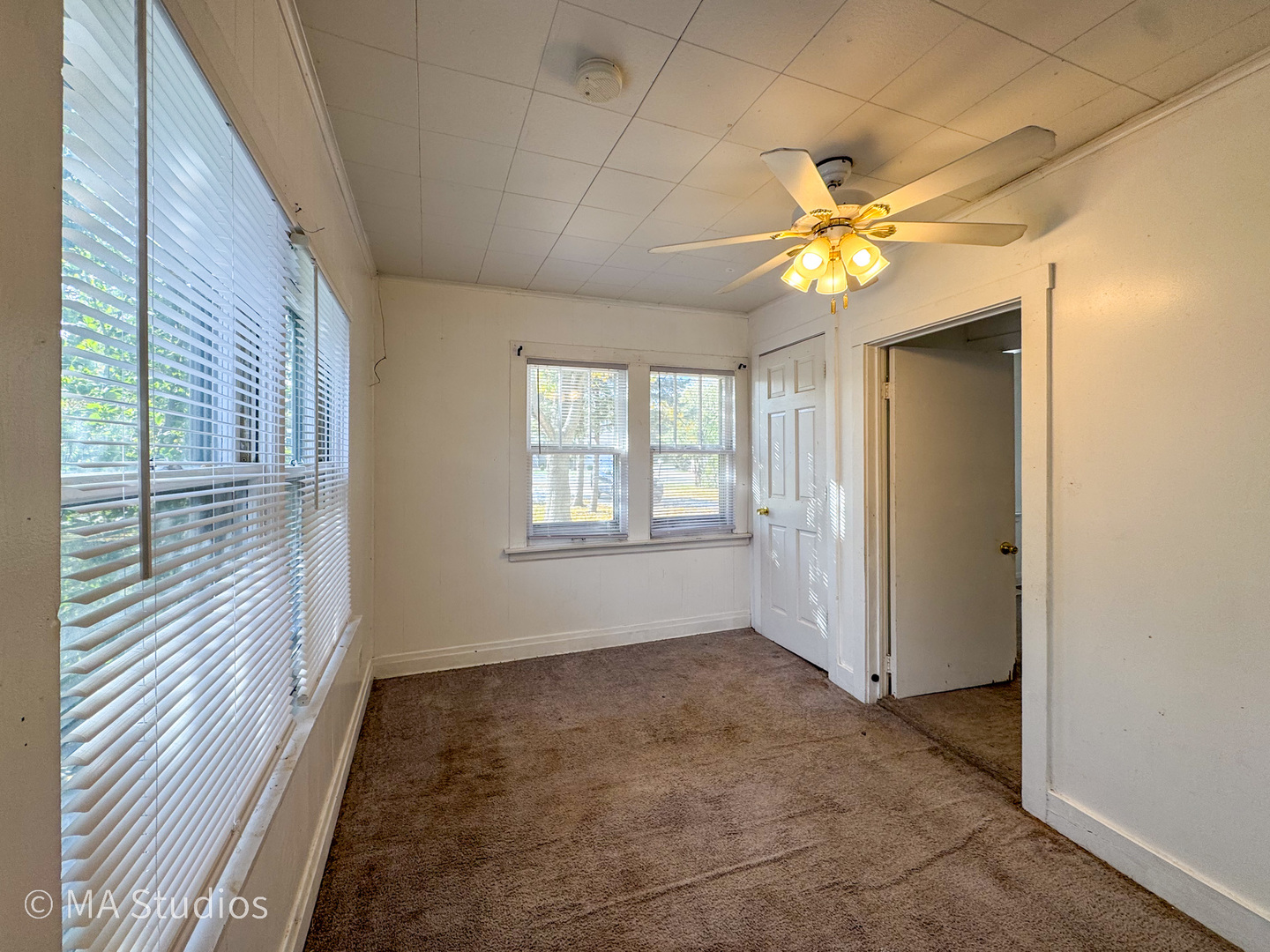 8-s057 South Vine Street Burr Ridge, IL 60527 - Photo 8 of 37 a view of an empty room with a window