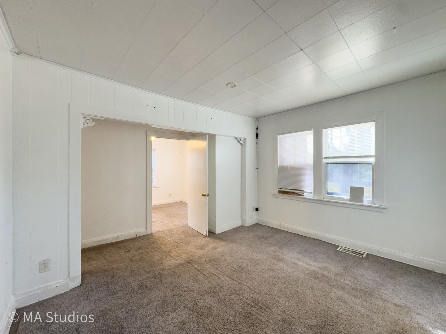 8-s057 South Vine Street Burr Ridge, IL 60527 - Photo 9 of 37 an empty room with windows