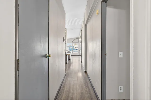 a view of a porch with wooden fence