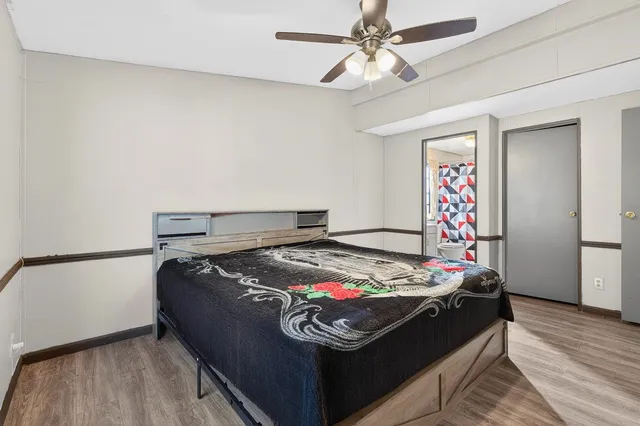 a bedroom with bed and window