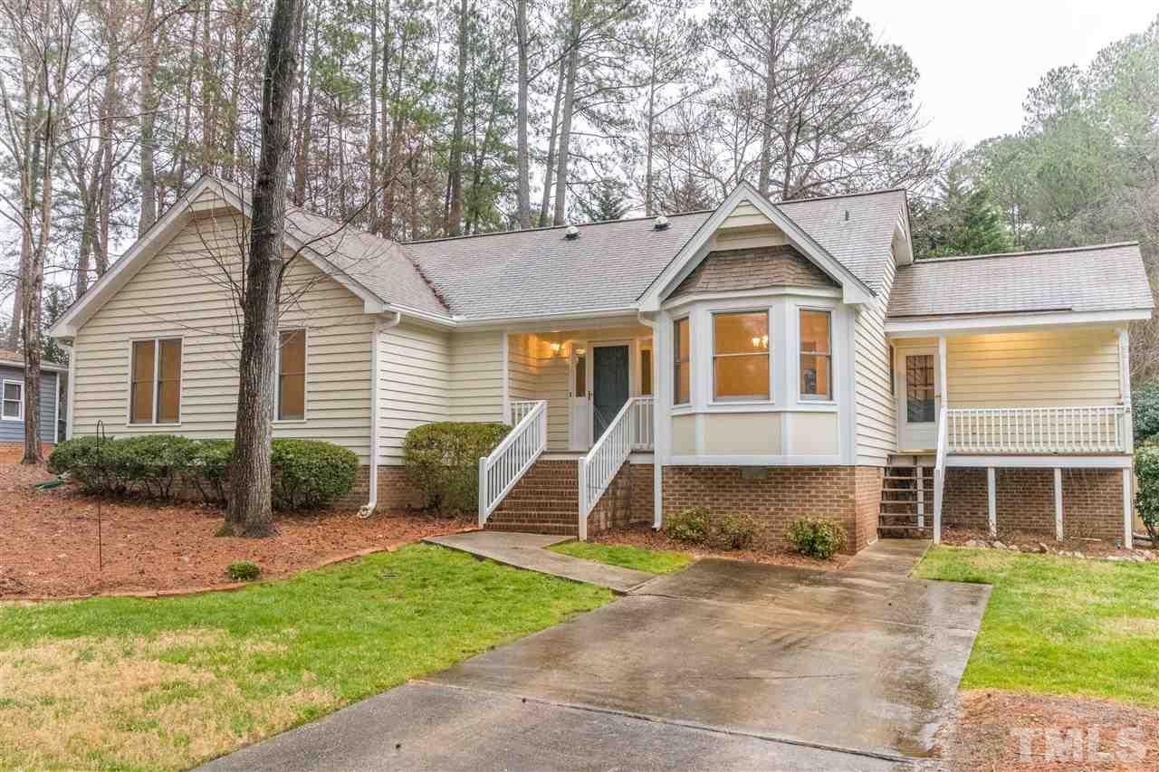 8300 Dunwood Court Raleigh, NC 27613 - Photo 1 of 18 a view of a house with a yard and plants