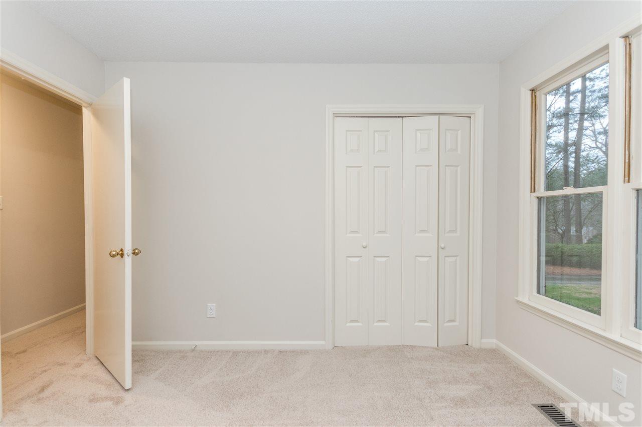 8300 Dunwood Court Raleigh, NC 27613 - Photo 11 of 18 an empty room with windows