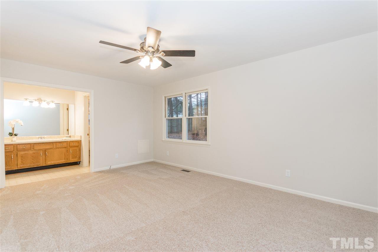 8300 Dunwood Court Raleigh, NC 27613 - Photo 12 of 18 a view of an empty room with a window