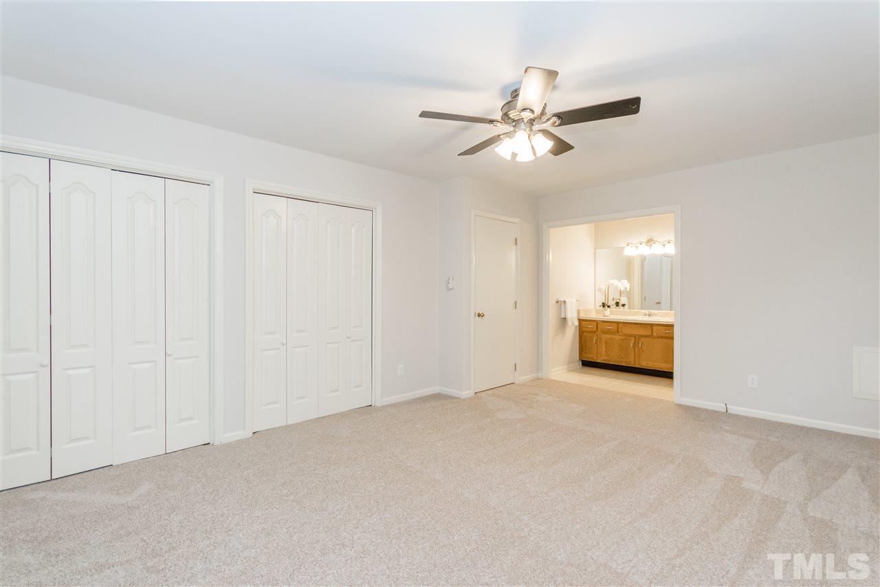 8300 Dunwood Court Raleigh, NC 27613 - Photo 14 of 18 a view of a livingroom with a ceiling fan and window