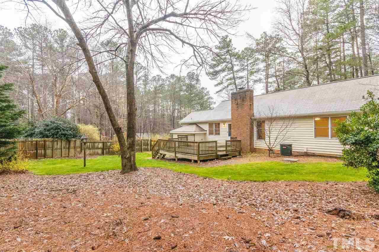 8300 Dunwood Court Raleigh, NC 27613 - Photo 18 of 18 a house with swimming pool in front of it