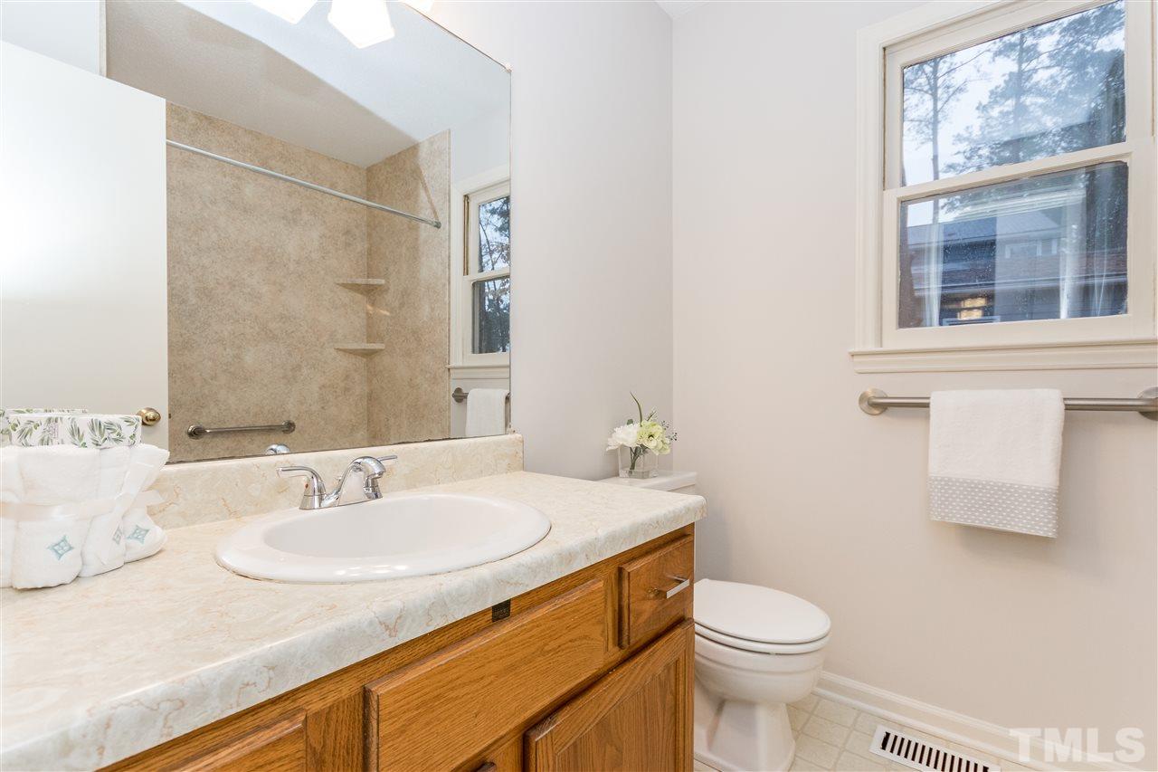 8300 Dunwood Court Raleigh, NC 27613 - Photo 9 of 18 a bathroom with a sink and a toilet