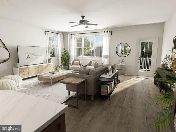 a living room with furniture and window