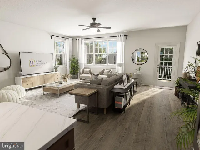 a living room with furniture and window