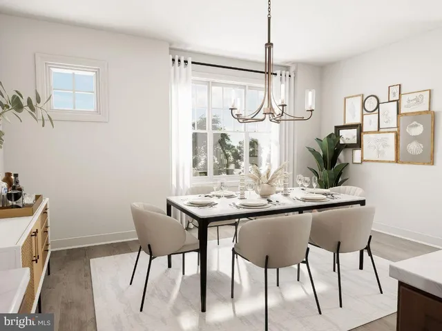 a view of a dining room with furniture and window