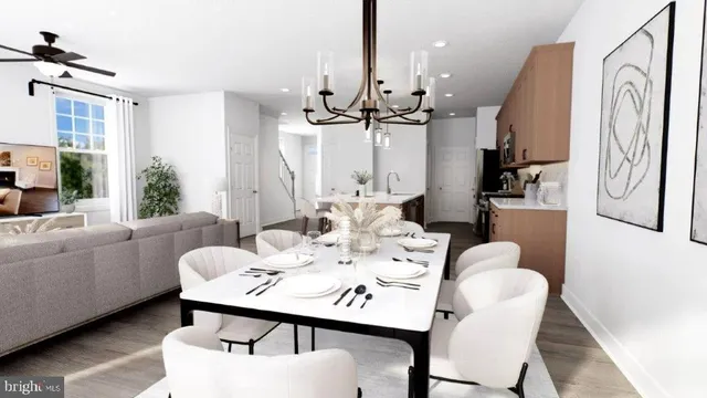a view of a a dining room with furniture window and wooden floor