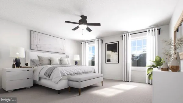 a spacious bedroom with a bed a couch and a window