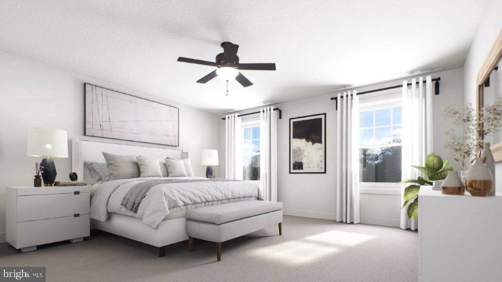 523 Linfield Road, Unit WESTERLY Royersford, PA 19468 - Photo 8 of 10 a spacious bedroom with a bed a couch and a window