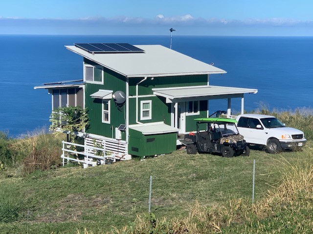 87-3395 Hawaii Belt Road Captain Cook, HI 96704 - Photo 1 of 30 a front view of a house with garden