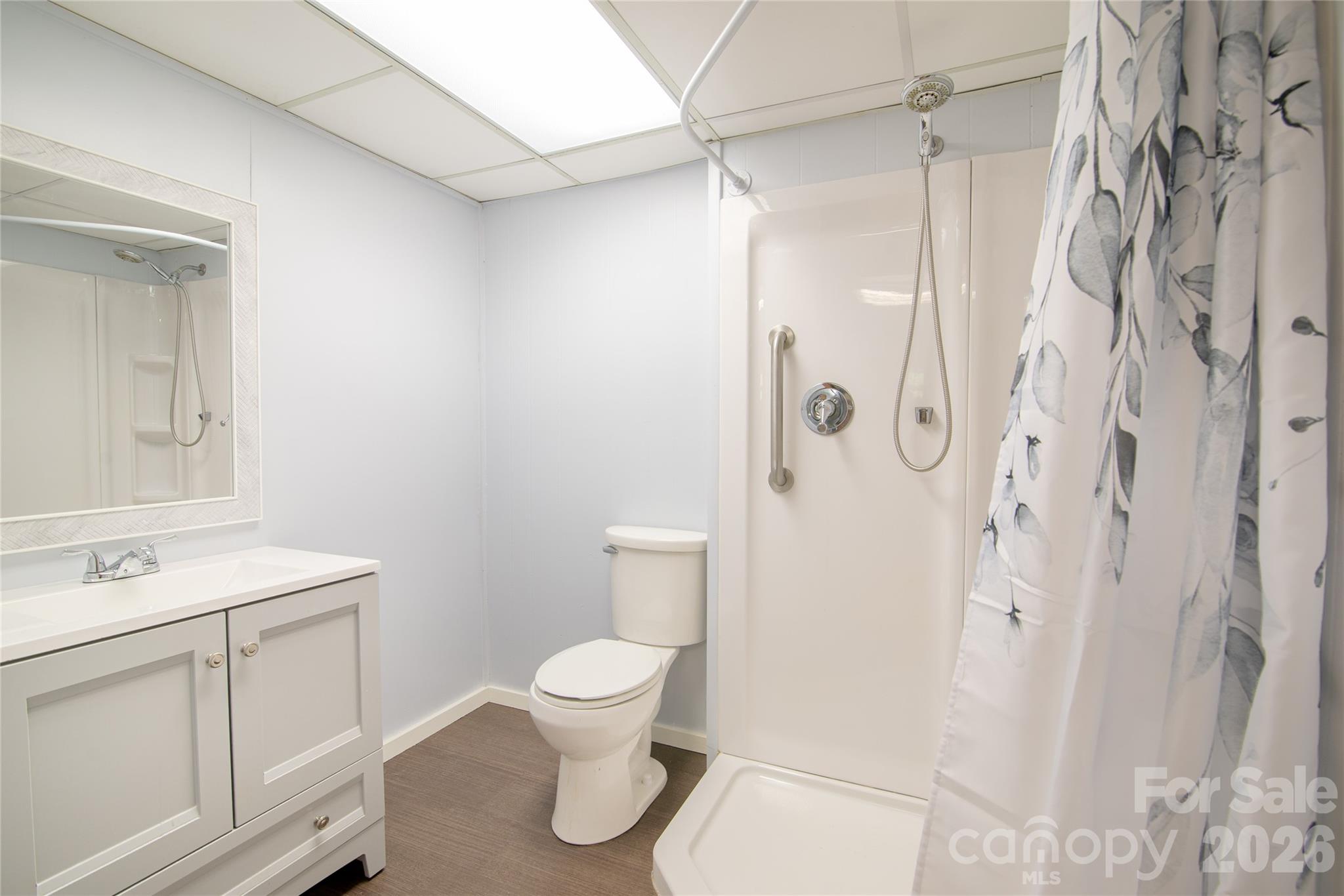 298 Timbuktu Road Sylva, NC 28779 - Photo 15 of 24 a white toilet sitting next to a bathroom sink