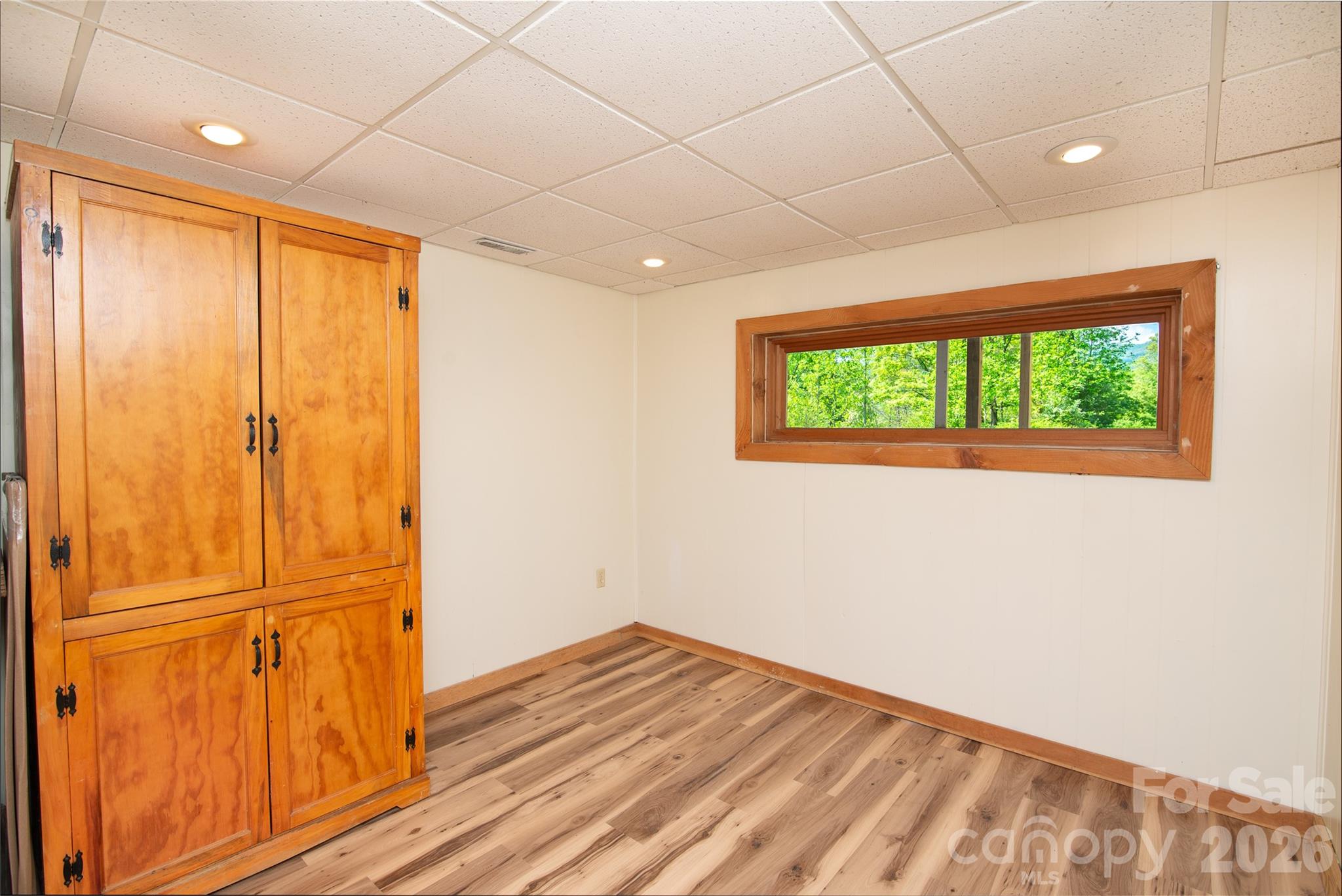 298 Timbuktu Road Sylva, NC 28779 - Photo 16 of 24 a view of empty room with wooden floor and fan