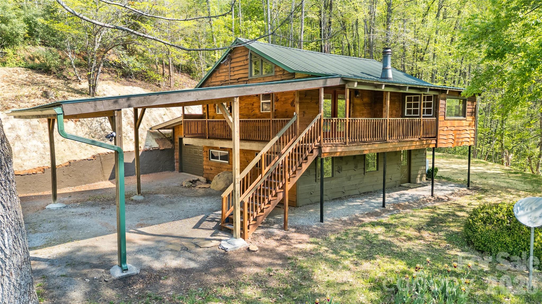 298 Timbuktu Road Sylva, NC 28779 - Photo 2 of 24 a view of a house with a backyard