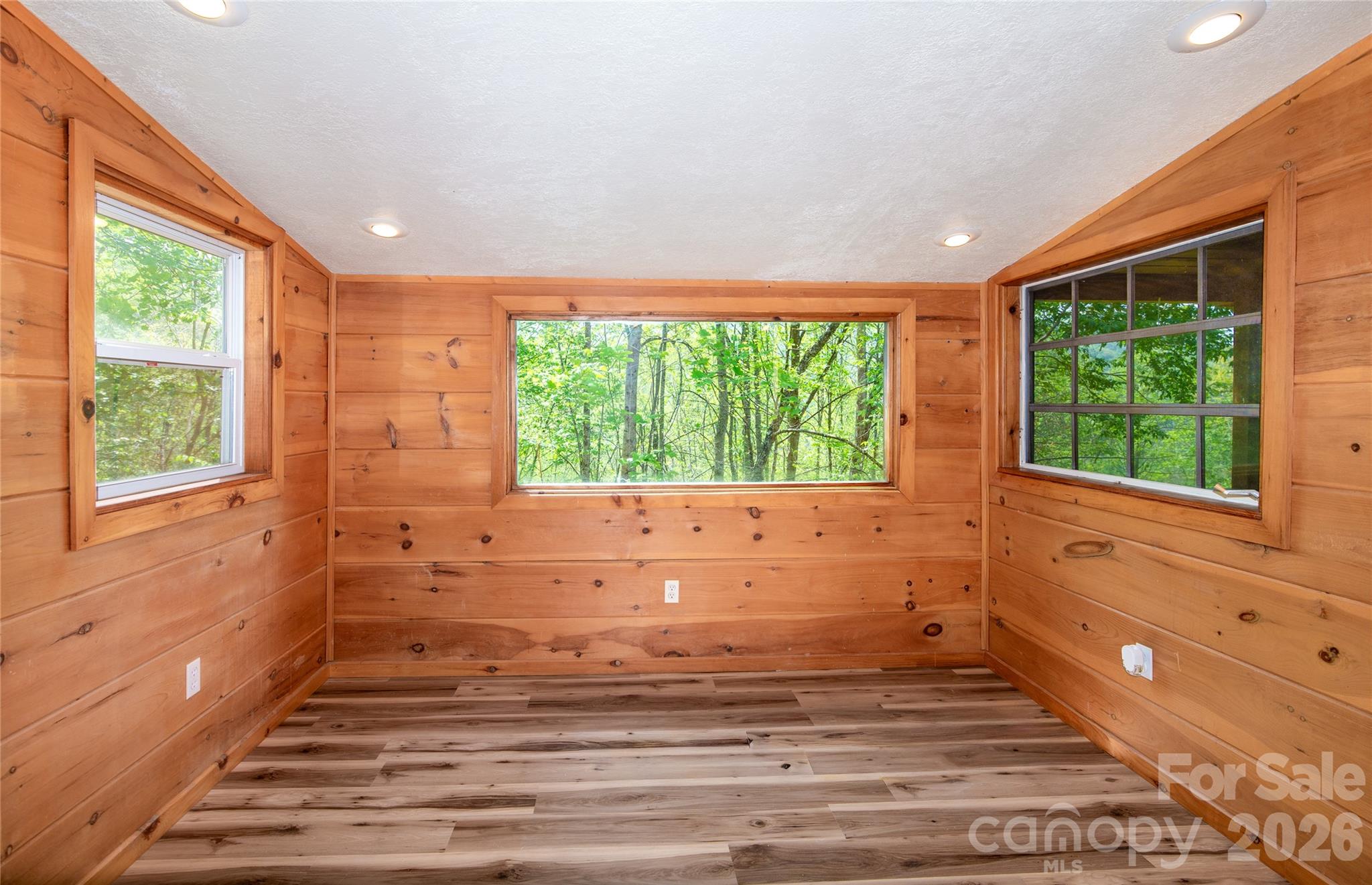 298 Timbuktu Road Sylva, NC 28779 - Photo 7 of 24 a view of wooden floor and windows in a room