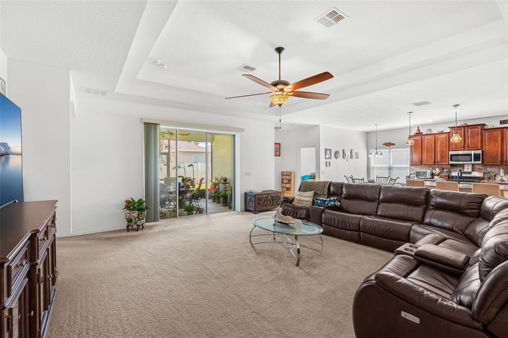 2085 Lula Road Minneola, FL 34715 - Photo 26 of 39 a living room with furniture and a large window