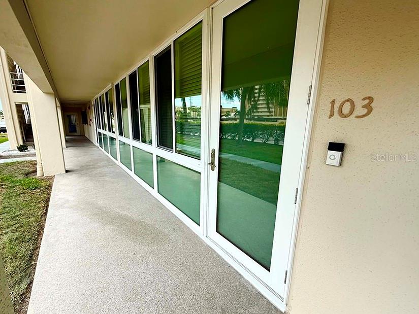 4455 Duhme Road, Unit 103 St. Petersburg, FL 33708 - Photo 1 of 37 a view of a porch