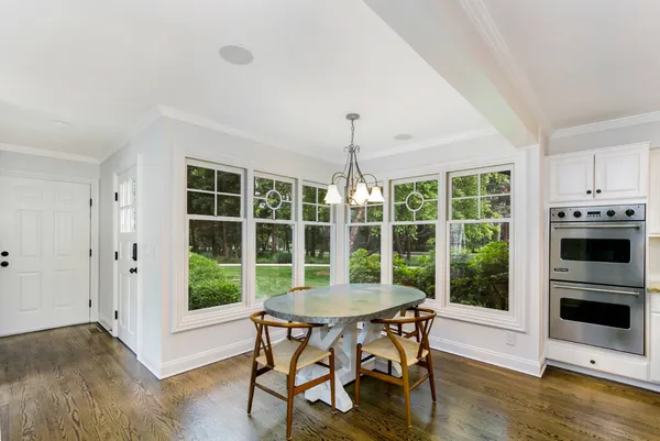 a view of a dining room with furniture window and wooden floor