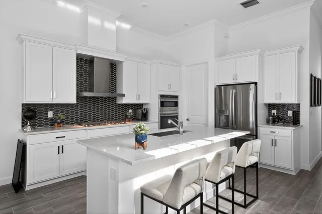 a view of a bedroom with furniture and window