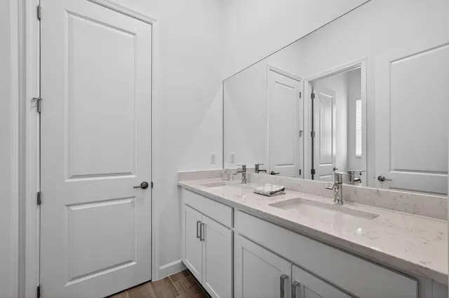 a bathroom with a toilet a sink and a mirror