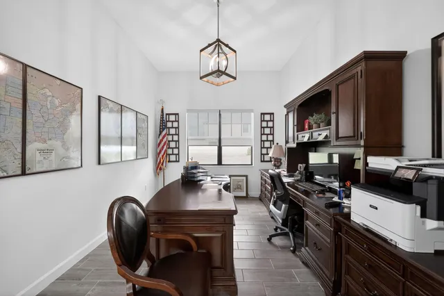 a view of a workspace with furniture and a couch