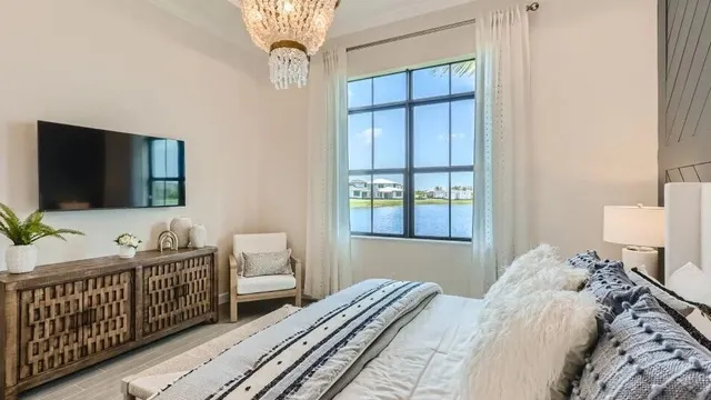 a bedroom with bed and a window